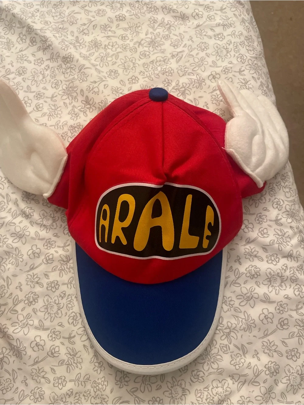 Ara Red and Blue Character Hat with White Wing Accents